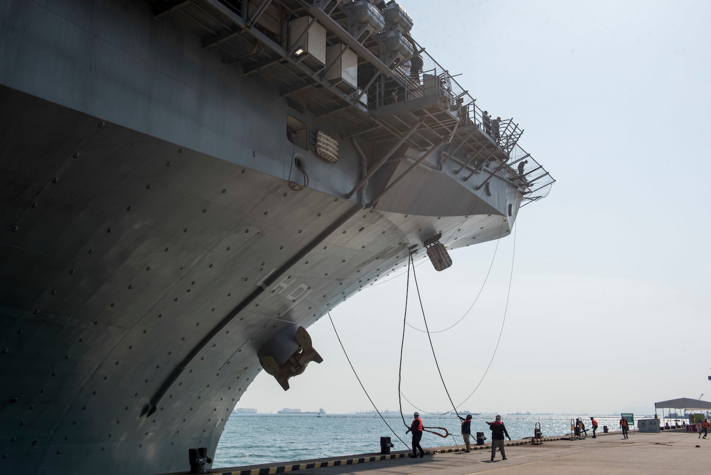 CHANGI NAVAL BASE, Singapore (October 2, 2018) The amphibious assault ship USS Wasp (LHD 1) arrives at Changi Naval Base in Singapore for a port visit. Wasp, the flagship for the Wasp Amphibious Ready Group, is operating in the Indo-Pacific region to enhance amphibious capabilities with regional partners and to serve as a ready-response force for any type of contingency.
