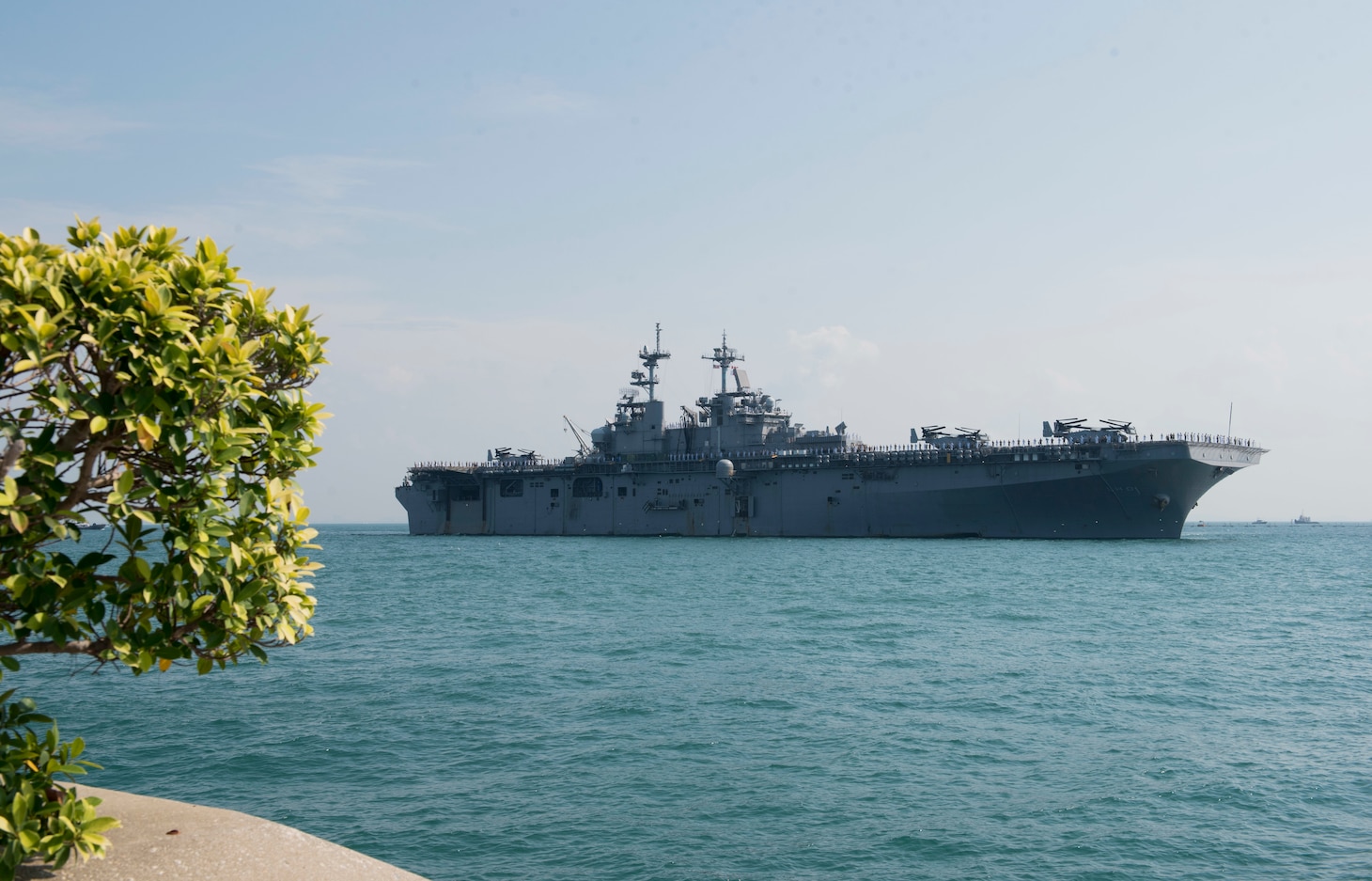 CHANGI NAVAL BASE, Singapore (October 2, 2018) The amphibious assault ship USS Wasp (LHD 1) arrives at Changi Naval Base in Singapore for a port visit. Wasp, the flagship for the Wasp Amphibious Ready Group, is operating in the Indo-Pacific region to enhance amphibious capabilities with regional partners and to serve as a ready-response force for any type of contingency.