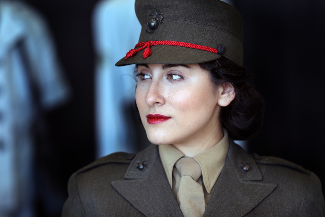 Michaela Negrete, a member of the AWRS-7 Lady Marines, looks at a display during the 2018 Marine Corps Air Station Miramar Air Show Sept. 29. This year’s air show honors “100 years of women in the Marine Corps” by featuring several performances and displays that highlight the accomplishments and milestones women have made since the first female enlistee, Opha May Johnson, who joined the service in 1918.