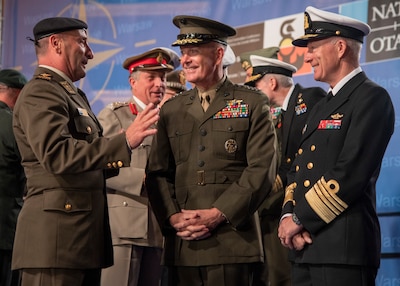 Joint chiefs chairman speaks with some of his counterparts.