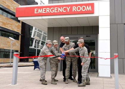 59th Medical Wing personnel cut the ribbon to officially transition the Urgent Care Clinic to a Family Emergency Center at Wilford Hall Ambulatory Surgical Center on Joint Base San Antonio-Lackland Oct. 1. The FEC will provide 24-hour emergency care to all Tricare beneficiaries in the San Antonio area who would have been previously transferred to local facilities.