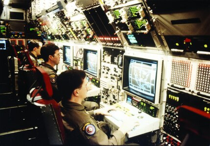Intelligence, surveillance and reconnaissance Airmen participate in airborne training on a Rivet Joint, RC-135VW, aircraft during an exercise in the mid-1990s.