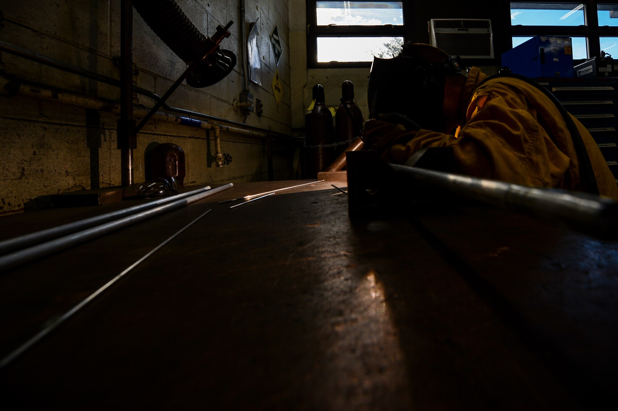 U.S. Air Force Staff Sgt. Matthew Mutz, 20th Equipment Maintenance Squadron aircraft metals technology journeyman, welds a metal rod at Shaw Air Force Base, S.C., Oct. 2, 2018.