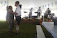 U.S. Army First Sergeant Taelimu Herrera, Headquarters and Headquarters Company, 7th Transportation Brigade (Expeditionary) first sergeant, dances with a member of the Happy Dutchmen during Oktoberfest at Joint Base Langley-Eustis, Virginia, Sept. 28, 2018. The Oktoberfest festival traditionally marks the beginning of the fall season. (U.S. Air Force photo by Senior Airman Derek Seifert)