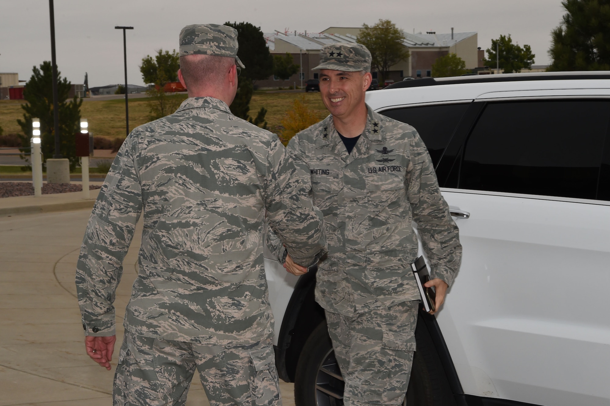 Col. Troy Endicott, 460th Space Wing commander, greets Maj. Gen. Stephen Whiting, 14th Air Force commander, Air Force Space Command, Sept. 28, 2018, on Buckley Air Force Base, Colorado. Whiting leads approximately 16,000 members responsible for providing strategic missile warning, nuclear command, control and communication, position, navigation and timing, space situational awareness, satellite operations, space launch and range operations. (U.S. Air Force photo by Senior Airman Codie Collins)