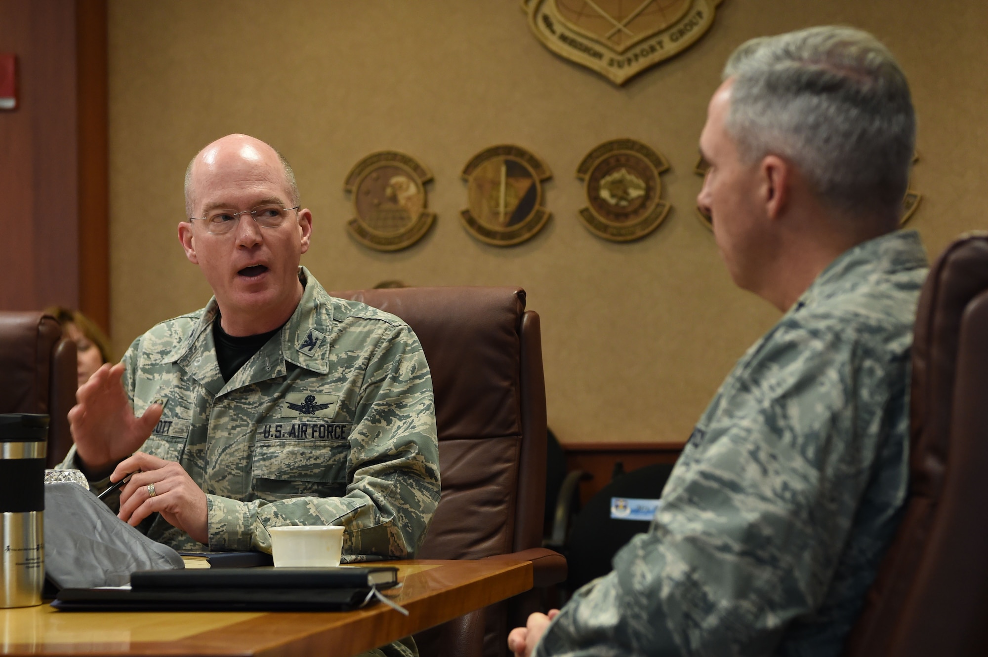 Col. Troy Endicott, 460th Space Wing commander, briefs Maj. Gen. Stephen Whiting, 14th Air Force commander, Air Force Space Command, Sept. 28, 2018, on Buckley Air Force Base, Colo. During the briefing Whiting and Endicott discussed how the 460th Space Wing priorities and strategic intent are aligned with 14th Air Force priorities. Whiting also met with Airmen at the 460th Operations Group, Mission Control Station and OPIR Battlespace Awareness Center during his visit to Buckley. (U.S. Air Force photo by Senior Airman Codie Collins)