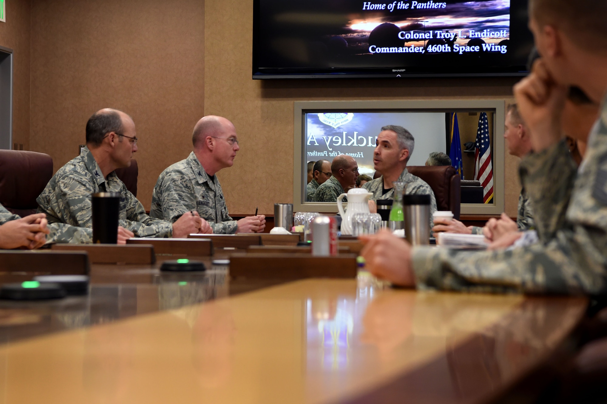 Col. Troy Endicott, 460th Space Wing commander, briefs Maj. Gen. Stephen Whiting, 14th Air Force commander, Air Force Space Command, Sept. 28, 2018, on Buckley Air Force Base, Colorado. Whiting is responsible for leading and guiding a diverse team of Airmen charged with protecting and defending critical U.S. and allied space capabilities. (U.S. Air Force photo by Senior Airman Codie Collins)