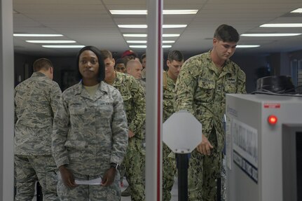 Airmen and Sailors process through the Passenger Terminal Oct. 2, 2018, at Joint Base Charleston, S.C. The service members were preparing for an incentive flight, which they earned by distinguishing themselves within their respective units. Leadership from the 628th Air Base Wing and the 437th Airlift Wing collaborated to provide flying opportunities for non-aircrew service members.