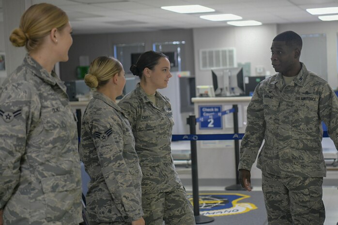 Col. Terrence Adams, Joint Base Charleston commander, speaks with a group of Airmen at the Passenger Terminal Oct. 2, 2018, at Joint Base Charleston, S.C. The service members were preparing for an incentive flight, which they earned by distinguishing themselves within their respective units. Leadership from the 628th Air Base Wing and the 437th Airlift Wing collaborated to provide flying opportunities for non-aircrew service members.