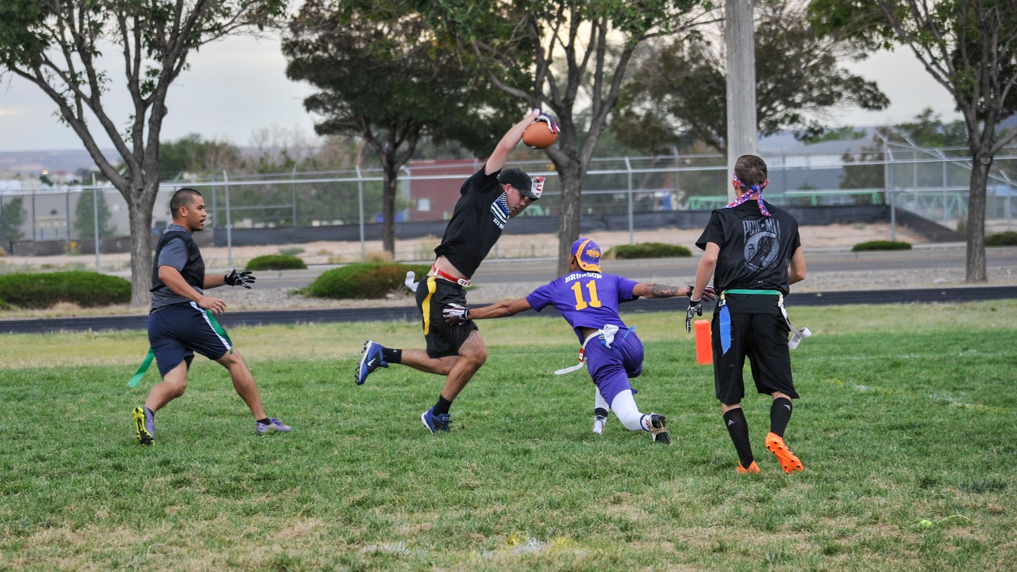 WSSS Stankiewics defender Richard Tarr jukes toward a touchdown after intercepting a pass from WSSS Joseph quarterback Tyrone Cook Oct. 1 in intramural flag football action. Stankiewics won 34-12. (U.S. Air Force photo by Jim Fisher)