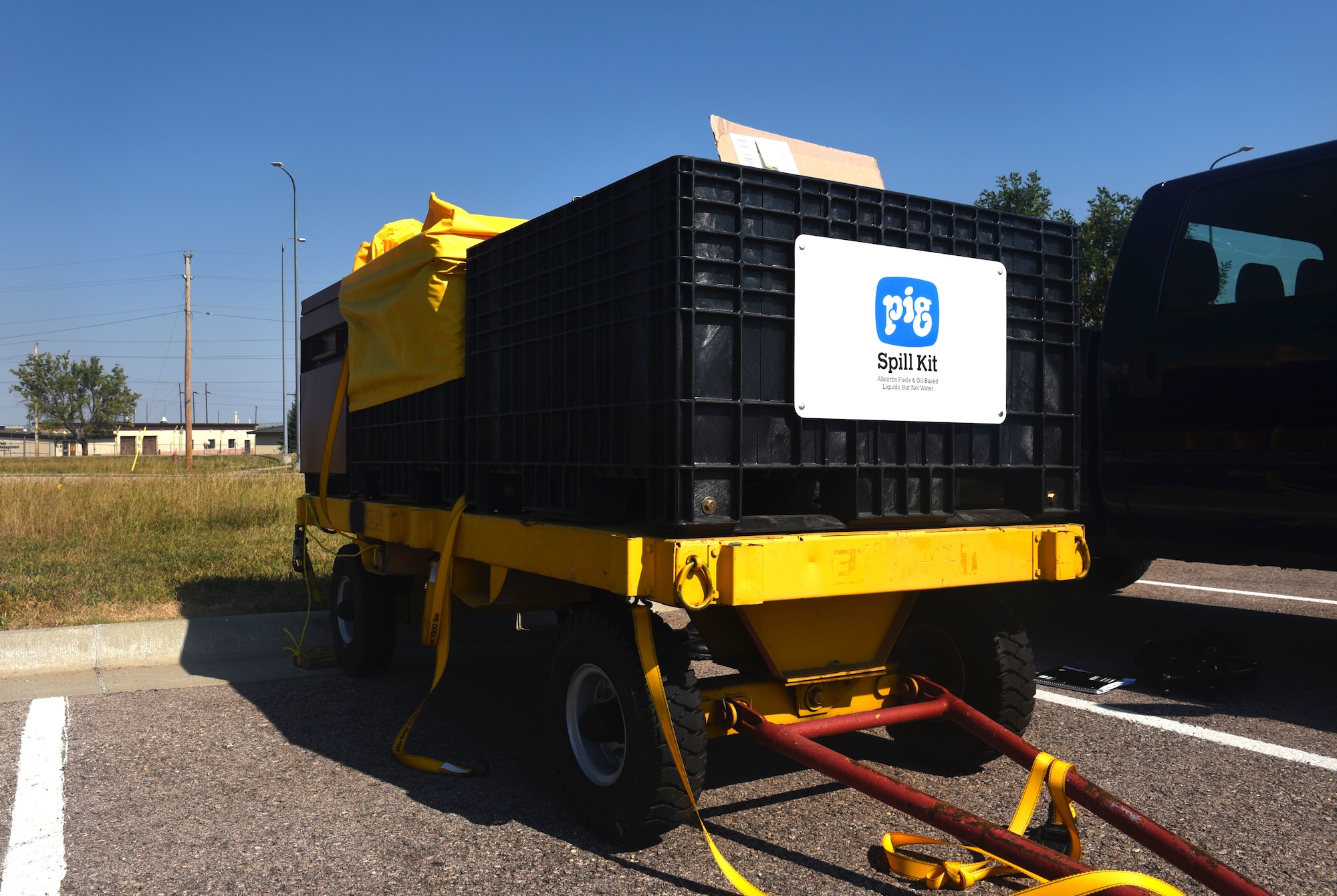 The SpillRaider II trailer is stored outside of the 28th Civil Engineer Squadron headquarters at Ellsworth Air Force Base, S.D., Sept. 17, 2018. The SpillRaider II trailer is equipped with a larger pump than SpillRaider I, and requires a larger air compressor like the ones typically be used by the 28th CES. (U.S. Air Force photo by Airman Christina Bennett)