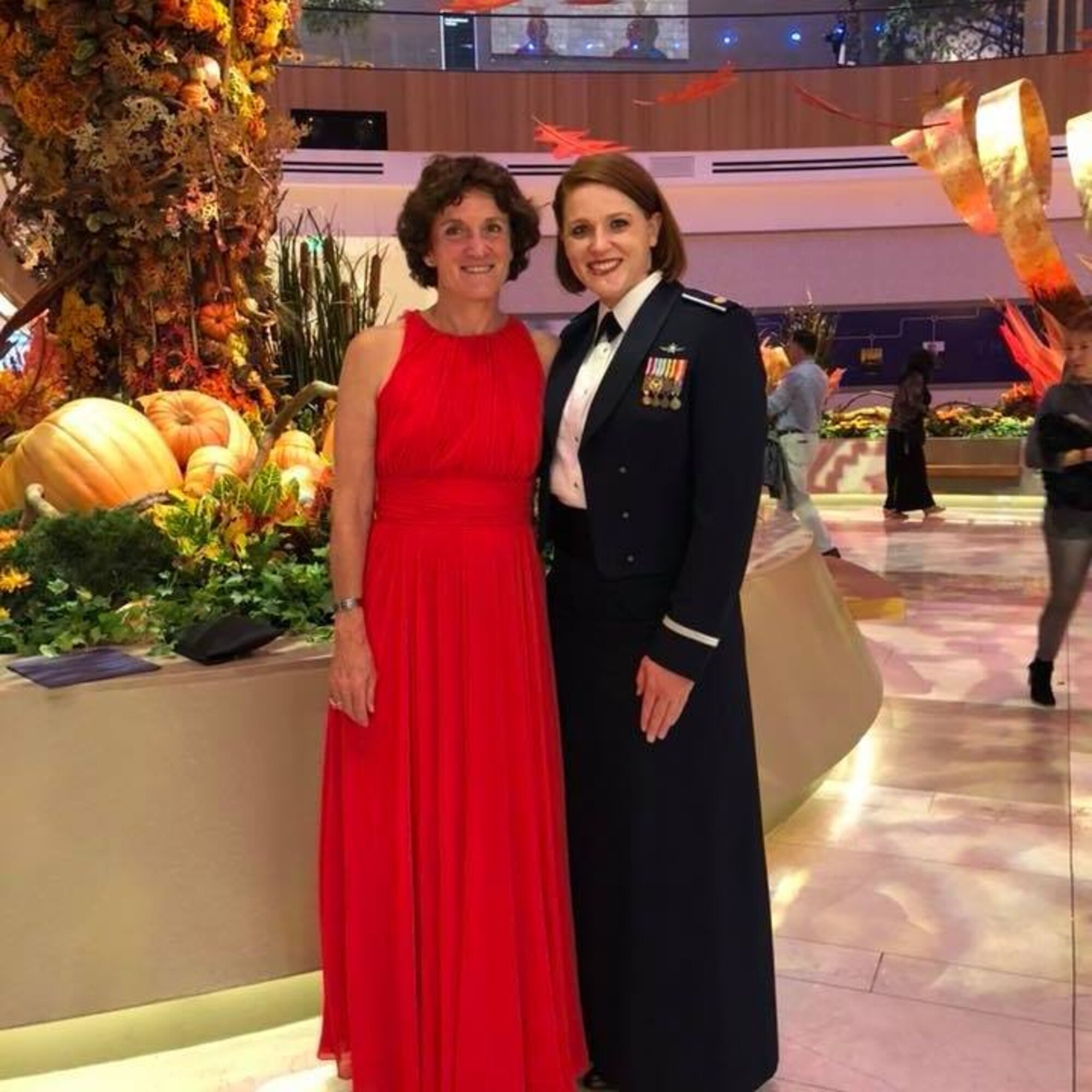 Linda Ambard, a violence prevention integrator at the 509th Bomb Wing at Whiteman Air Force Base, Missouri, left, stands with her daughter, U.S. Air Force Maj. Emily Short, during the Air Force Symposium dinner Sept. 19, 2018 at National Harbor, Maryland. Ambard and her daughter attended the dinner for the official release of the Gold Star Family video that Ambard narrated. (Courtesy photo)