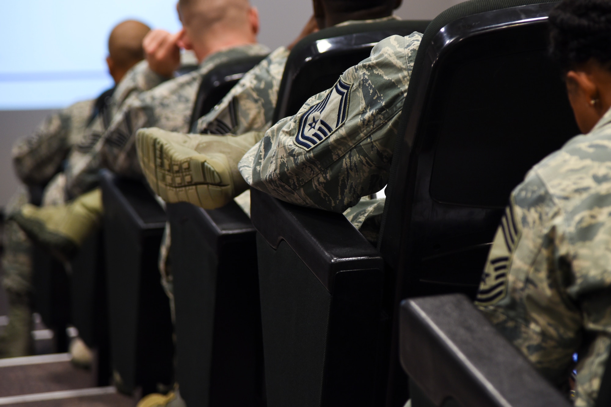U.S. Air Forces in Europe and U.S. Air Forces Africa Squadron Superintendent and Spouse course attendees wait between briefings at the USAFE conference center on Ramstein Air Base, Germany, Sept. 25, 2018. USAFE leadership recognized the need for training at the superintendent level and created the course geared towards superintendents who have been in the position less than a year and those who have been vectored toward the job. (U.S. Air Force photo by Airman D. Blake Browning)