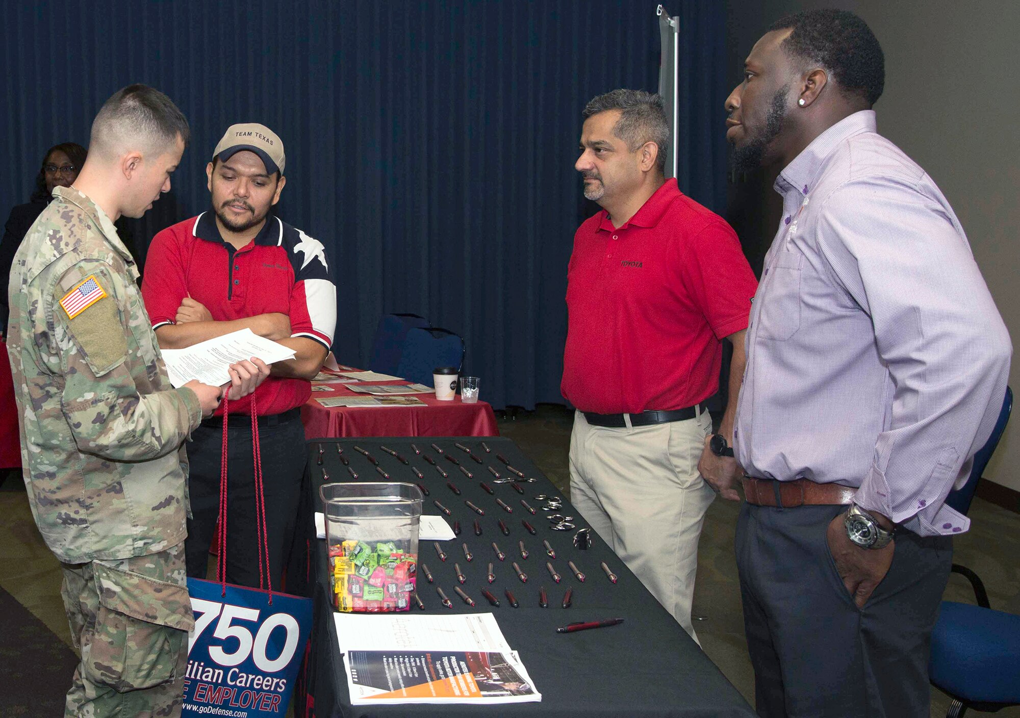 Employers meet with military members during the Hiring Heroes Career Fair at the Sam Houston Community Center at Joint Base San Antonio-Fort Sam Houston Sept. 19. More than 70 employers, from the private to the governmental sector, were present to showcase their employment opportunities, as well as scout America's best talent.