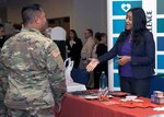 Employers meet with military members during the Hiring Heroes Career Fair at the Sam Houston Community Center at Joint Base San Antonio-Fort Sam Houston Sept. 19. More than 70 employers, from the private to the governmental sector, were present to showcase their employment opportunities, as well as scout America's best talent.
