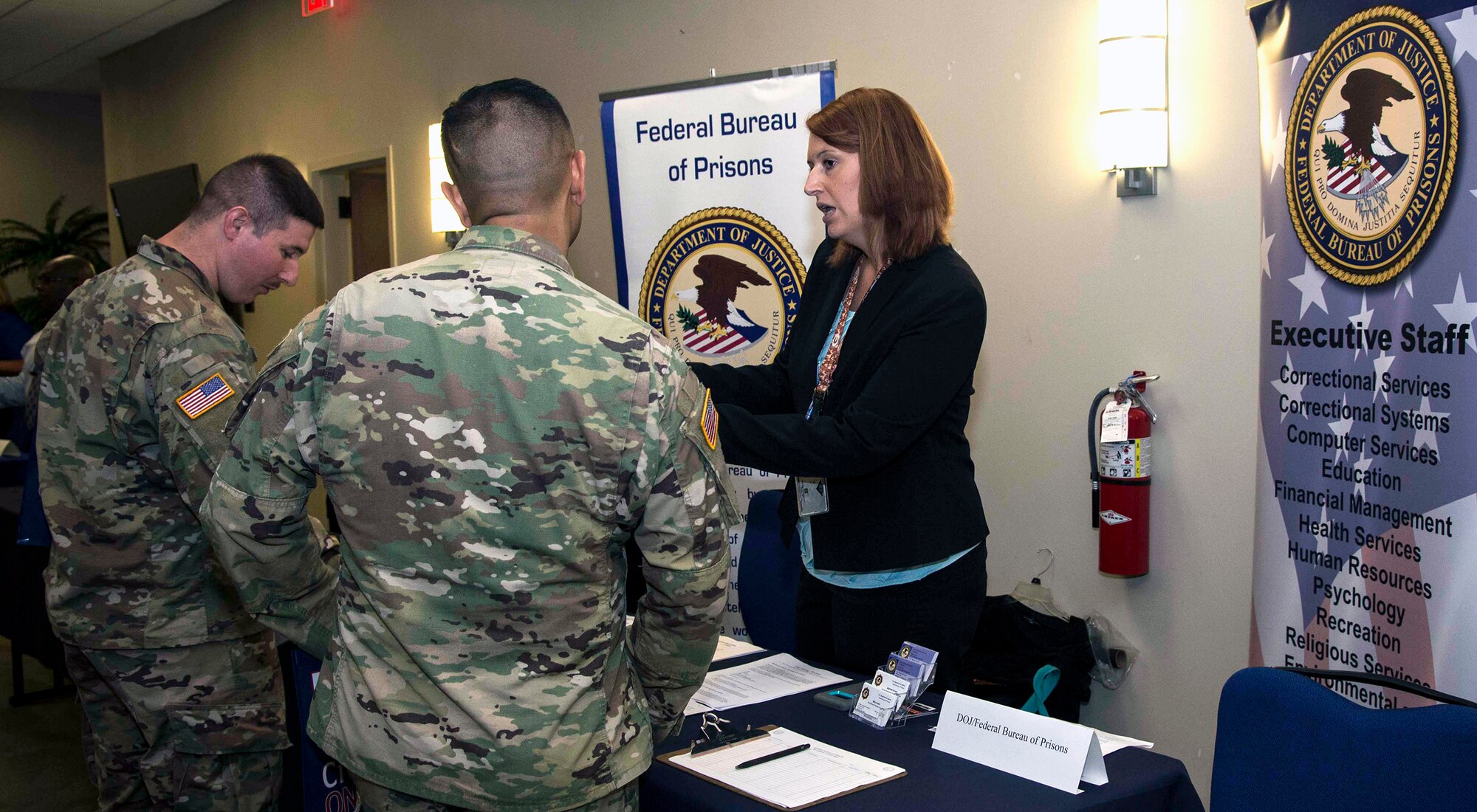 Employers meet with military members during the Hiring Heroes Career Fair at the Sam Houston Community Center at Joint Base San Antonio-Fort Sam Houston Sept. 19. More than 70 employers, from the private to the governmental sector, were present to showcase their employment opportunities, as well as scout America's best talent.