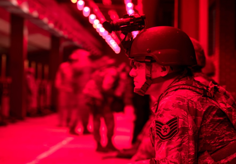 U.S. Air Force Tech. Sgt. Jared Martin, 633rd Security Forces Squadron flight chief readies his night vision goggles during night fire weapons training at Joint Base Langley-Eustis, Virginia, Aug. 23, 2018. Battlefield Airmen must perform night fire weapons training every year to maintain mission readiness. (U.S. Air Force photo by Airman 1st Class Anthony Nin Leclerec)