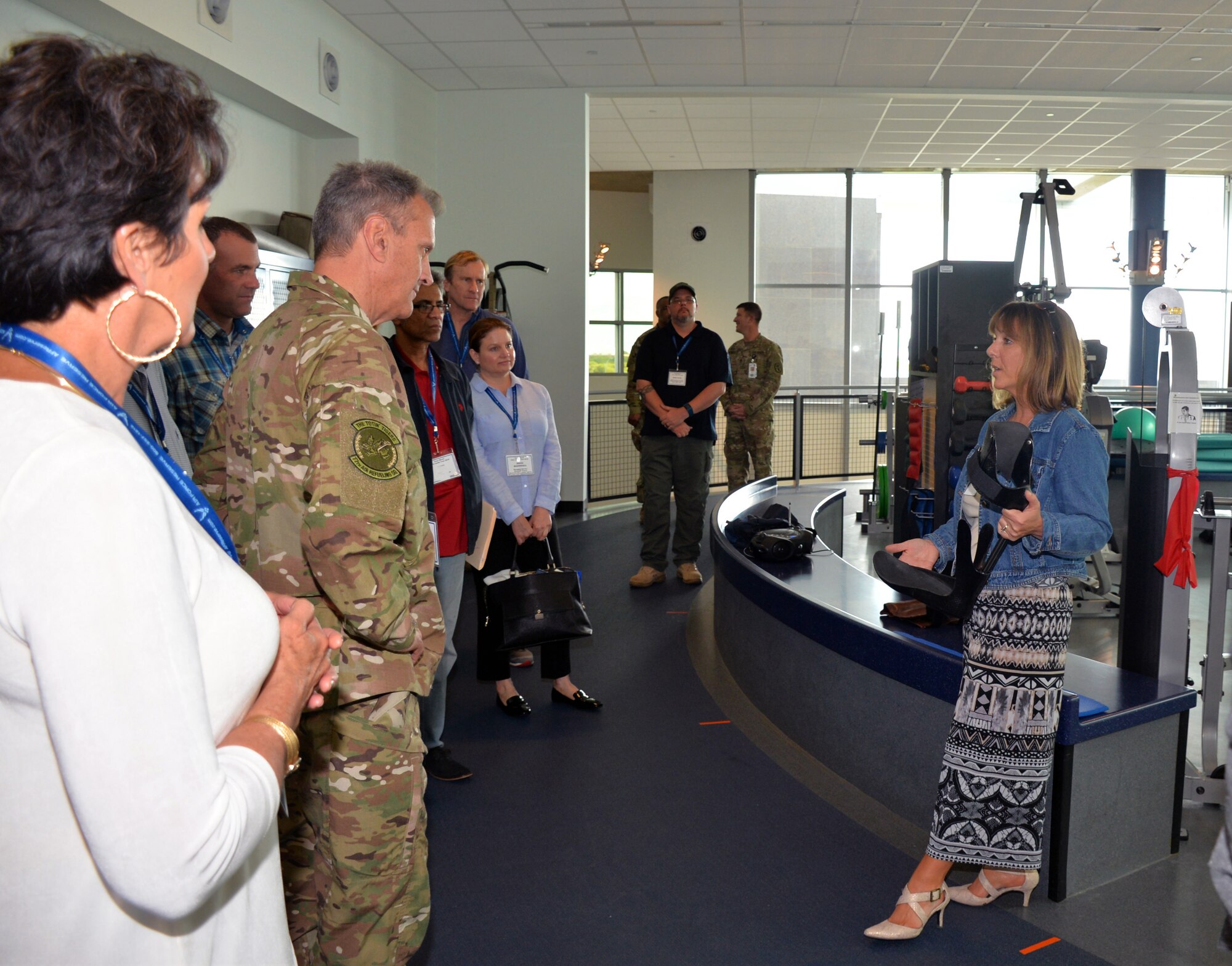 Lori Leal, Center for the Intrepid secretary, describes an Intrepid Dynamic Exoskeleton Orthosis at the Center for the Intrepid to a group of civic leaders from the March Air Reserve Base, California area at Joint Base San Antonio-Fort Sam Houston, Texas Oct. 1, 2018.