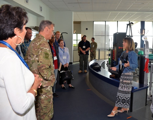 Lori Leal, Center for the Intrepid secretary, describes an Intrepid Dynamic Exoskeleton Orthosis at the Center for the Intrepid to a group of civic leaders from the March Air Reserve Base, California area at Joint Base San Antonio-Fort Sam Houston, Texas Oct. 1, 2018.