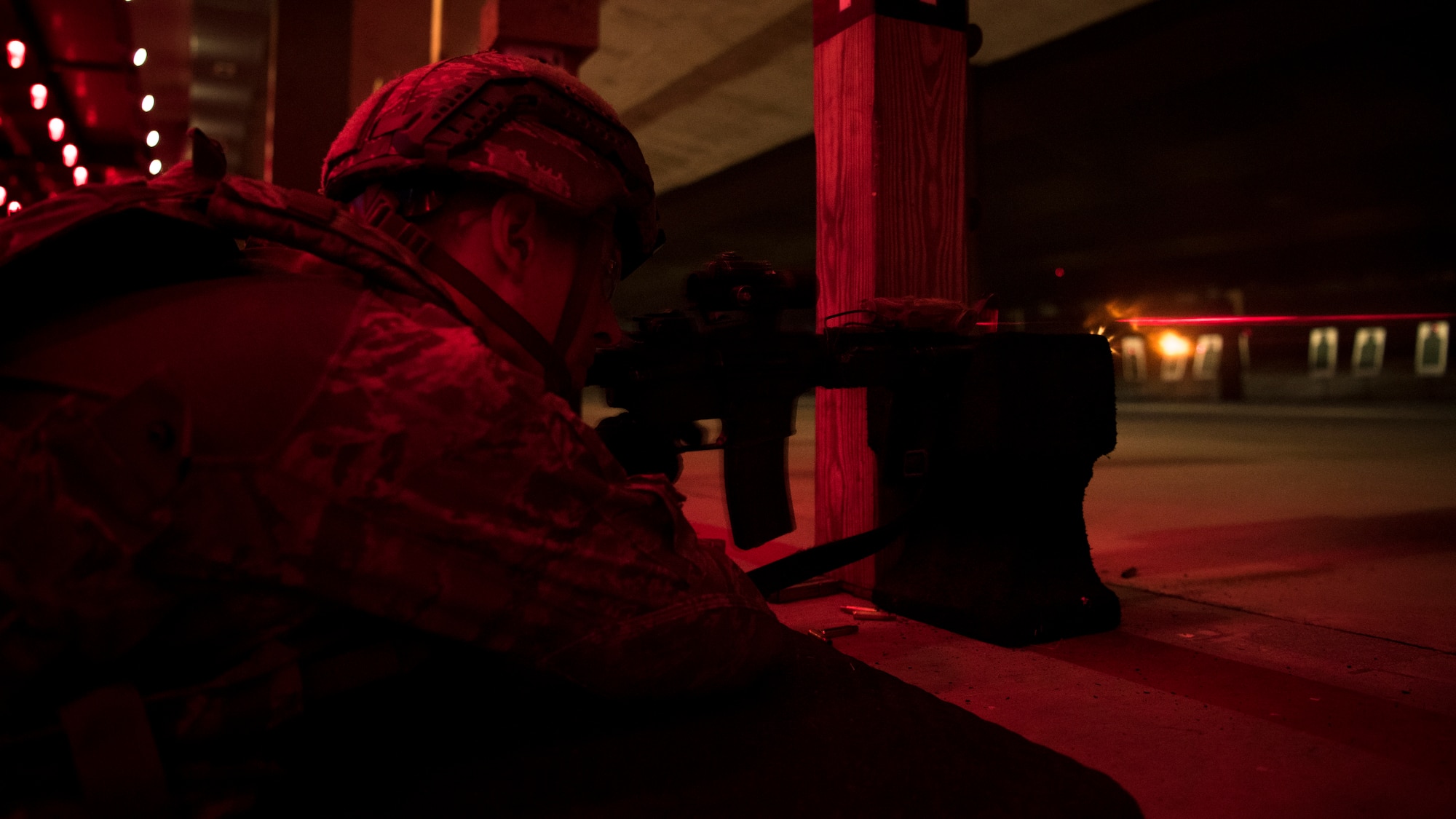 U.S. Air Force Senior Airman Cordyon Scott, 633rd Security Forces Squadron Base Defense Operations Center controller, fires the M4 carbine during night fire weapons training at Joint Base Langley-Eustis, Virginia, August 23, 2018.