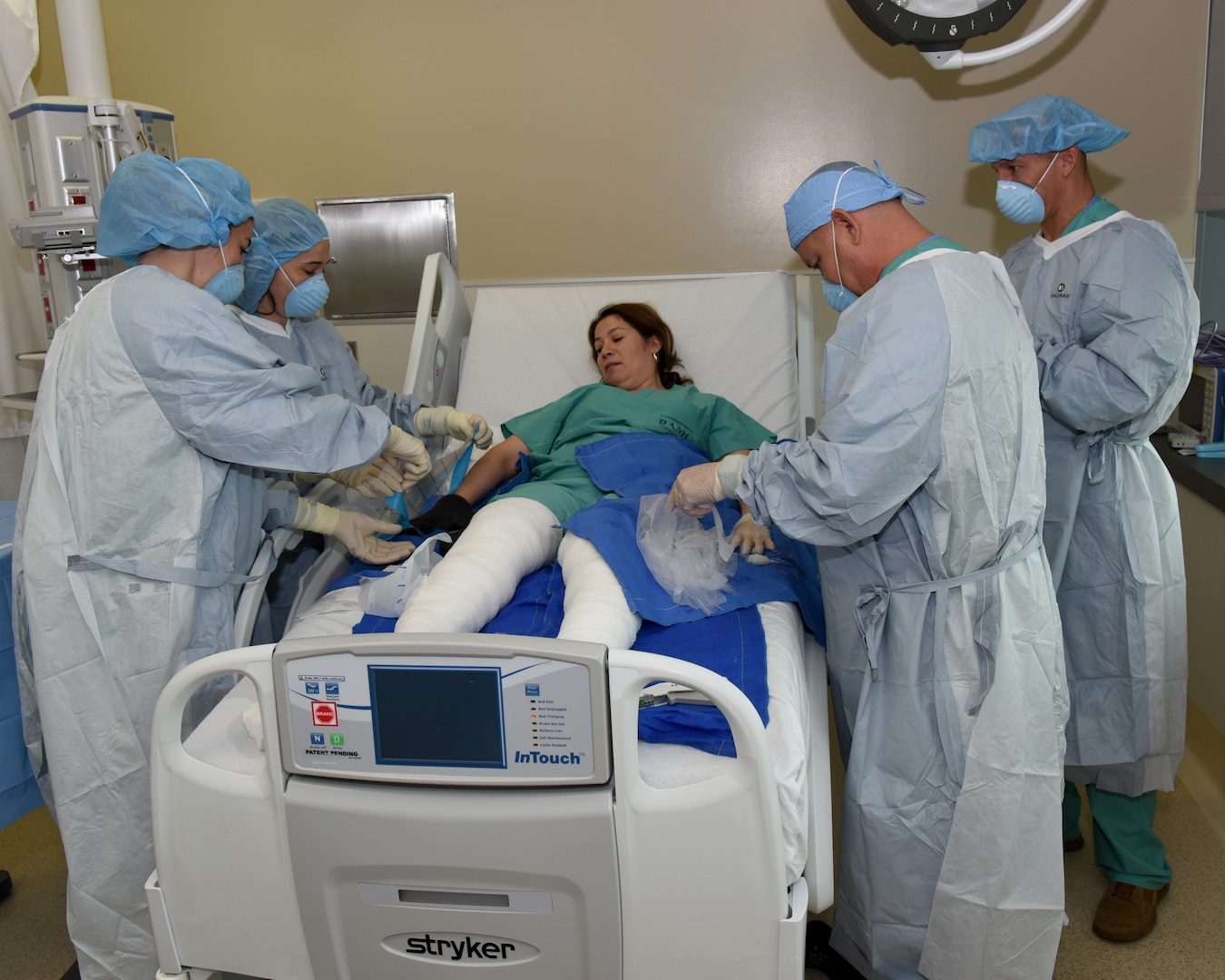 The nurses at the U.S. Army Institute of Surgical Research Burn Center Intensive Care Unit were divided into teams to perform specific simulated wound care techniques on a staff member from their group during a staff development day at Joint Base San Antonio-Fort Sam Houston Sept. 14.