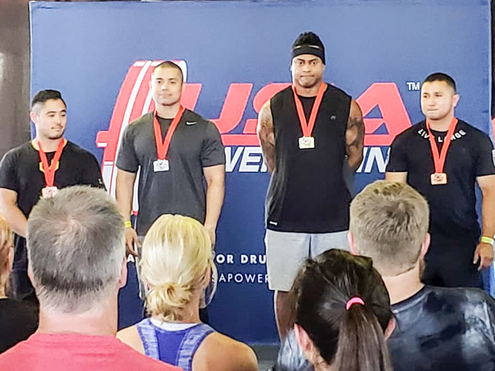 Staff Sgt. Christopher LaCour, second from left, a mission systems technican with the 225th Support Squadron, places second in the 93 kg weight class during the Northwest Regional USA Powerlifting Competition July 29, 2018.   LaCour qualified for Nationals in Spokane, Washington, Oct. 11-15, 2018.