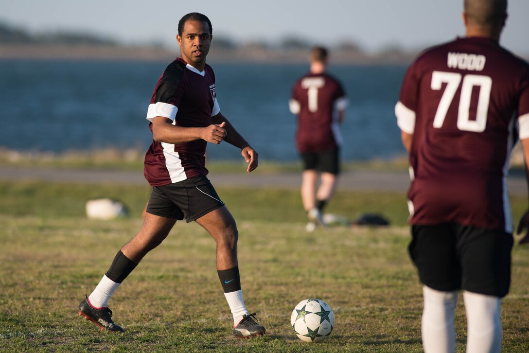 U.S. Air Force Airman 1st Class Jairzinho Burke, 633rd Air Base Wing Judge Advocate paralegal, assesses the opposition during an intramural soccer game at Joint Base Langley-Eustis, Virginia, April 12, 2018.