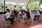 Members of the San Antonio Spurs take on injured service members in a friendly game of wheelchair basketball at Brooke Army Medical Center's Center for the Intrepid, Joint Base San Antonio-Fort Sam Houston, Oct. 1. The Spurs also toured the state-of-the-art CFI rehab facility before the game. The CFI provides rehabilitation for military members who have sustained amputation, burns or functional limb loss.