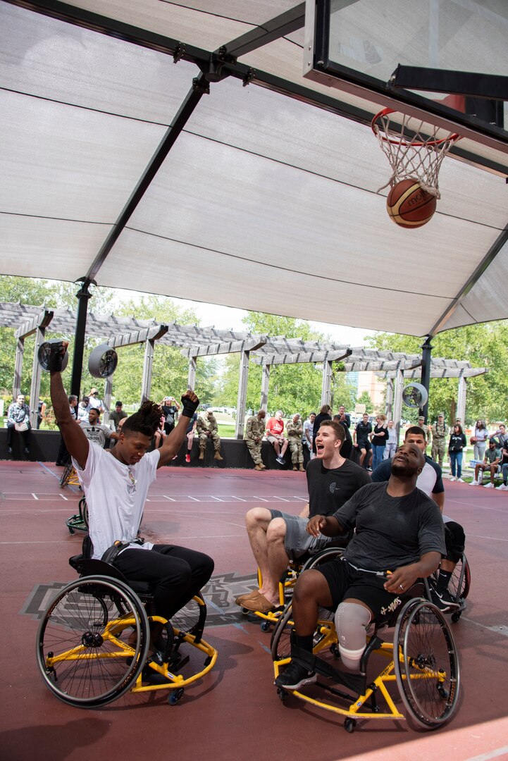 San Antonio Spurs rookie shooting guard Lonnie Walker IV celebrates making a shot during a friendly game of wheelchair basketball against injured service members at Brooke Army Medical Center's Center for the Intrepid at Joint Base San Antonio-Fort Sam Houston Oct. 1. The Spurs also toured the state-of-the-art CFI rehab facility before the game. The CFI provides rehabilitation for military members who have sustained amputation, burns or functional limb loss.
