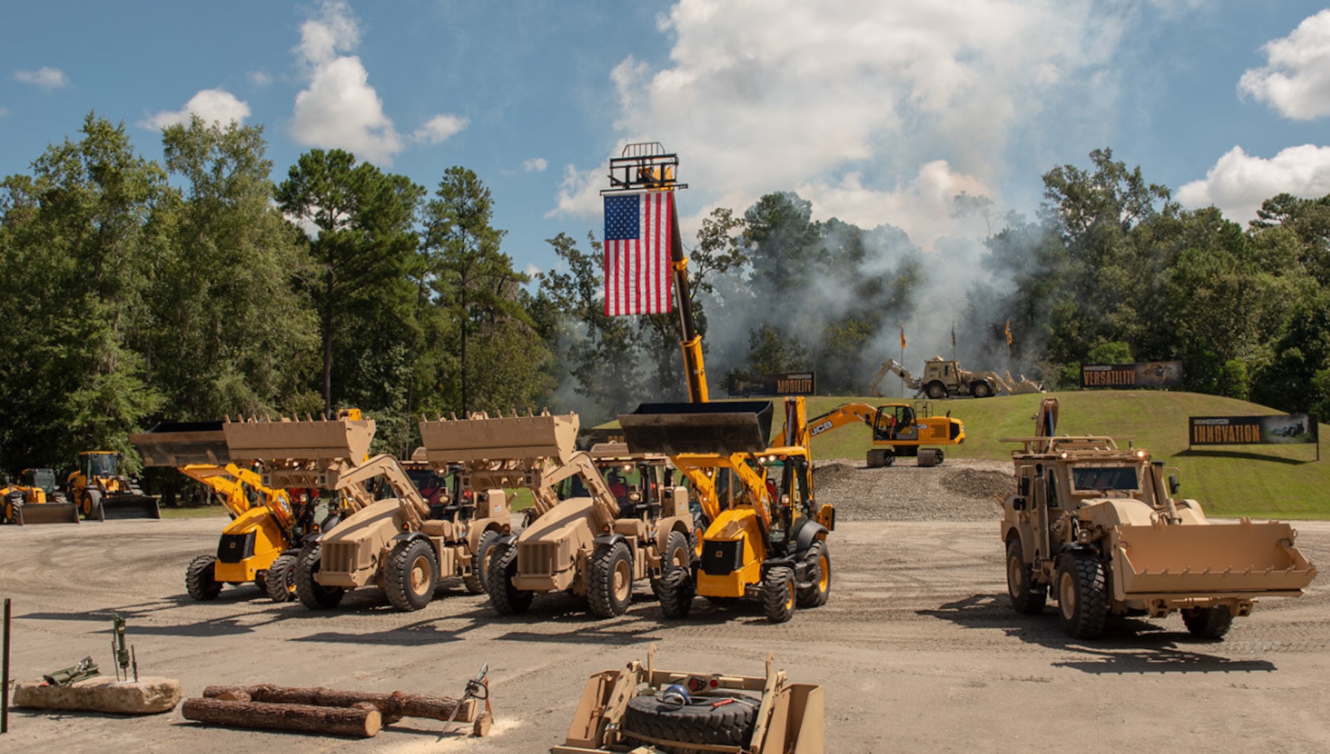Outside photo of the American flag and multiple excavators