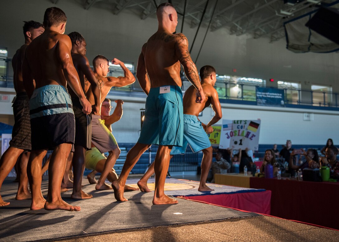 Langley Classics Bodybuilding competition participants pose on stage at Joint Base Langley-Eustis, Virginia, Sept. 29, 2018.