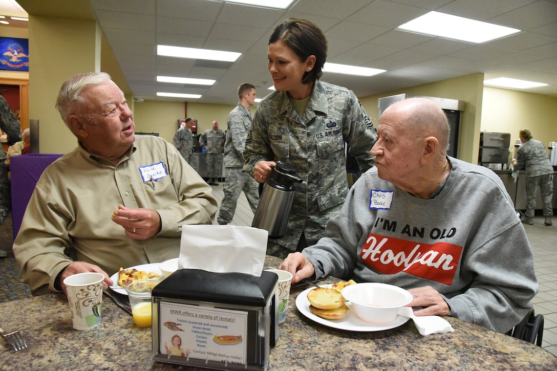 Senior Master Sgt. Merri Jo ‘MJ’ Filloon, of the 119th Wing, serves coffee to retired Maj. Gen. Keith Bjerke, left, and retired Chief Master Sgt. Chris Barke at the North Dakota Air National Guard Base, Fargo, N.D., Oct. 3, 2018.
