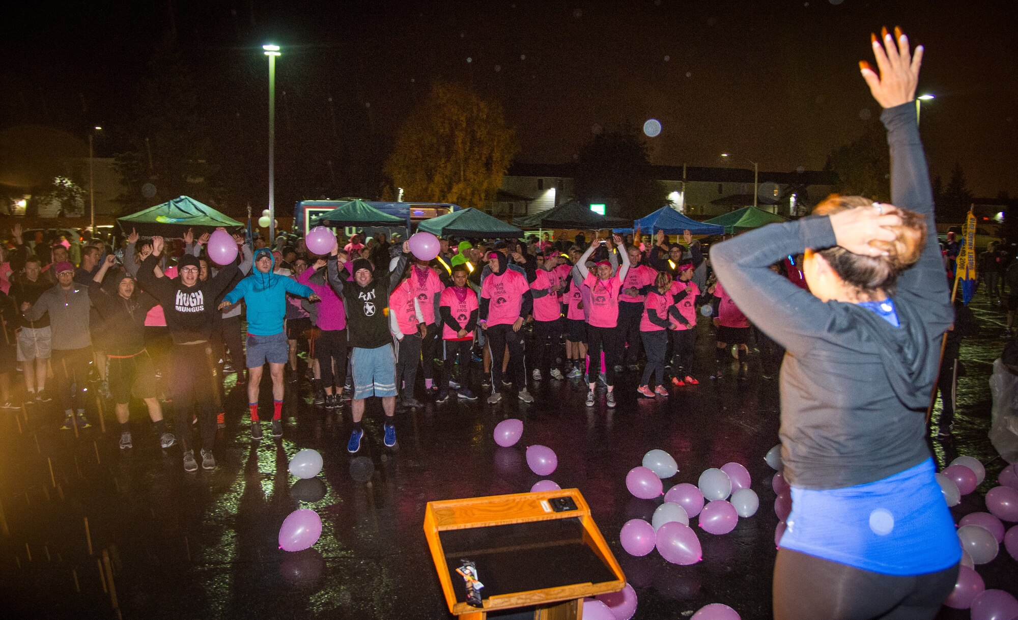 Gloria Bechtol, Buckner Physical Fitness Center dance instructor, gets Soldiers and Airmen warmed up with a dance session before a breast cancer awareness 5K run at Joint Base Elmendorf-Richardson, Alaska, Sept. 28, 2018. More than 300 Soldiers, Airmen and members of the JBER community rallied together to support Breast Cancer Awareness Month. October is nationally recognized as Breast Cancer Awareness Month with the goal of raising awareness of breast cancer signs and symptoms and emphasizing the importance of early diagnosis.