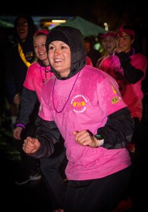 U.S. Army 1st Sgt. Amanda Sidonio, assigned to the 95th Chemical Company, 17th Combat Sustainment Support Battalion, U.S. Army Alaska, participates in dance to warm up for a breast cancer awareness 5K at Joint Base Elmendorf-Richardson, Alaska, Sept. 28, 2018. October is nationally recognized as Breast Cancer Awareness Month with the goal of raising awareness of breast cancer signs and symptoms and emphasizing the importance of early diagnosis.