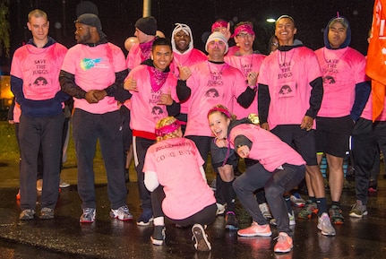 Soldiers, Airmen and members of the Joint Base Elmendorf-Richardson community show some spirit prior to a breast cancer awareness 5K run at JBER, Alaska, Sept. 28, 2018. More than 300 people rallied together to support Breast Cancer Awareness Month. The National Breast Cancer Awareness Foundation estimates 220,000 U.S. women will be diagnosed with breast cancer each year and over 40,000 will perish. October is nationally recognized as Breast Cancer Awareness Month with the goal of raising awareness of breast cancer signs and symptoms and emphasizing the importance of early diagnosis.