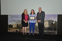 IMAGE: DAHLGREN, Va. (Sept. 21, 2018) – Victoria Rozanski receives her certificate of appreciation from Naval Surface Warfare Center Dahlgren Division (NSWCDD) Acting Chief of Staff Terri Gray and Acting Deputy Technical Director Chris Clifford at the 2018 NSWCDD Academic Recognition Ceremony.