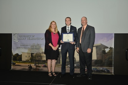 IMAGE: DAHLGREN, Va. (Sept. 21, 2018) – Evan Savaria receives his certificate of appreciation from Naval Surface Warfare Center Dahlgren Division (NSWCDD) Acting Chief of Staff Terri Gray and Acting Deputy Technical Director Chris Clifford at the 2018 NSWCDD Academic Recognition Ceremony.