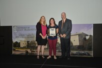 IMAGE: DAHLGREN, Va. (Sept. 21, 2018) – Jennifer Green receives her certificate of appreciation from Naval Surface Warfare Center Dahlgren Division (NSWCDD) Acting Chief of Staff Terri Gray and Acting Deputy Technical Director Chris Clifford at the 2018 NSWCDD Academic Recognition Ceremony.
