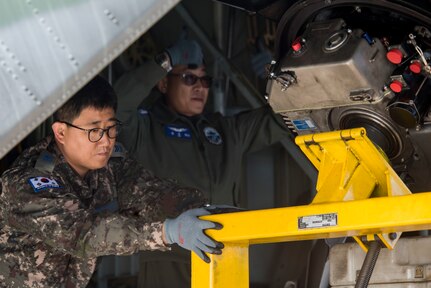 Republic of Korea Air Force Master Sgt. SeungJoo Lee and ROKAF Chief Master Sgt. Wooseop Lim, loadmasters assigned to the 15th Special Missions Wing, help unload cargo from a ROKAF C-130 Hercules during Red Flag-Alaska 18-4 at Joint Base Elmendorf-Richardson, Alaska, Oct. 1, 2018. Red Flag-Alaska is a Pacific Air Forces-directed field training exercise for U.S. and international forces flown under simulated air combat conditions. The exercises are focused on improving the combat readiness of U.S. and international forces and providing training for units preparing for air expeditionary force taskings.