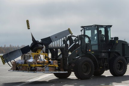 U.S. Air Force Senior Airman Anfernee Butler, a ground transportation vehicle operator with the 374th Logistics Readiness Squadron, Yokota Air Base, Japan, moves cargo unloaded from a Republic of Korea C-130 Hercules, operating a 10k all-terrain forklift, during Red Flag-Alaska 18-4 at Joint Base Elmendorf-Richardson, Alaska, Oct. 1, 2018. Red Flag-Alaska is a Pacific Air Forces-directed field training exercise for U.S. and international forces flown under simulated air combat conditions. The exercises are focused on improving the combat readiness of U.S. and international forces and providing training for units preparing for air expeditionary force taskings.