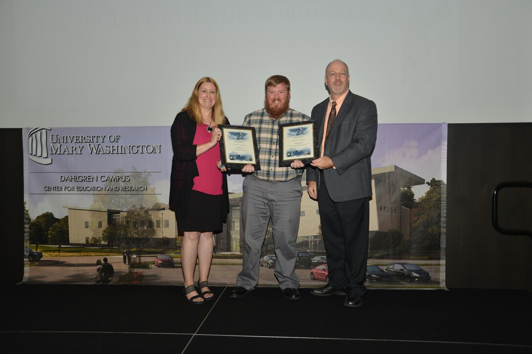 IMAGE: DAHLGREN, Va. (Sept. 21, 2018) – Nicholas Jones receives his certificates of achievement from Naval Surface Warfare Center Dahlgren Division (NSWCDD) Acting Chief of Staff Terri Gray and Acting Deputy Technical Director Chris Clifford at the 2018 NSWCDD Academic Recognition Ceremony.