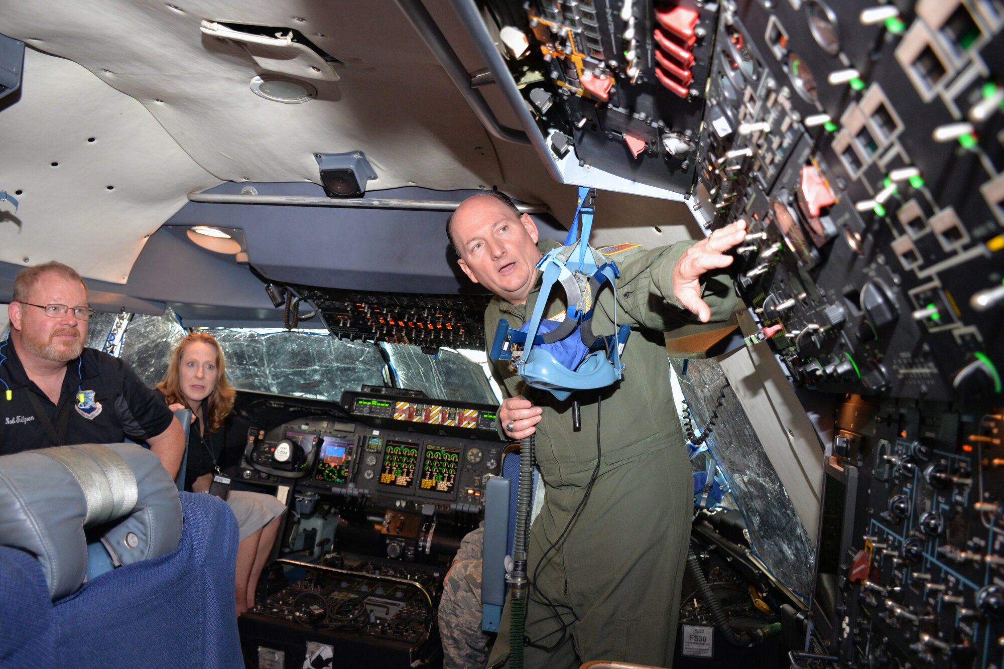 Col. Thomas K. Smith Jr., 433rd Airlift Wing commander, explains functions of aircraft controls on the flight deck of a C-5M Super Galaxy to Bob Tullgren, Air Force Personnel Center manpower authorization manager, and Lori Marcum, AFPC chief of manpower Oct. 2, 2018 at Joint Base San Antonio-Lackland, Texas.