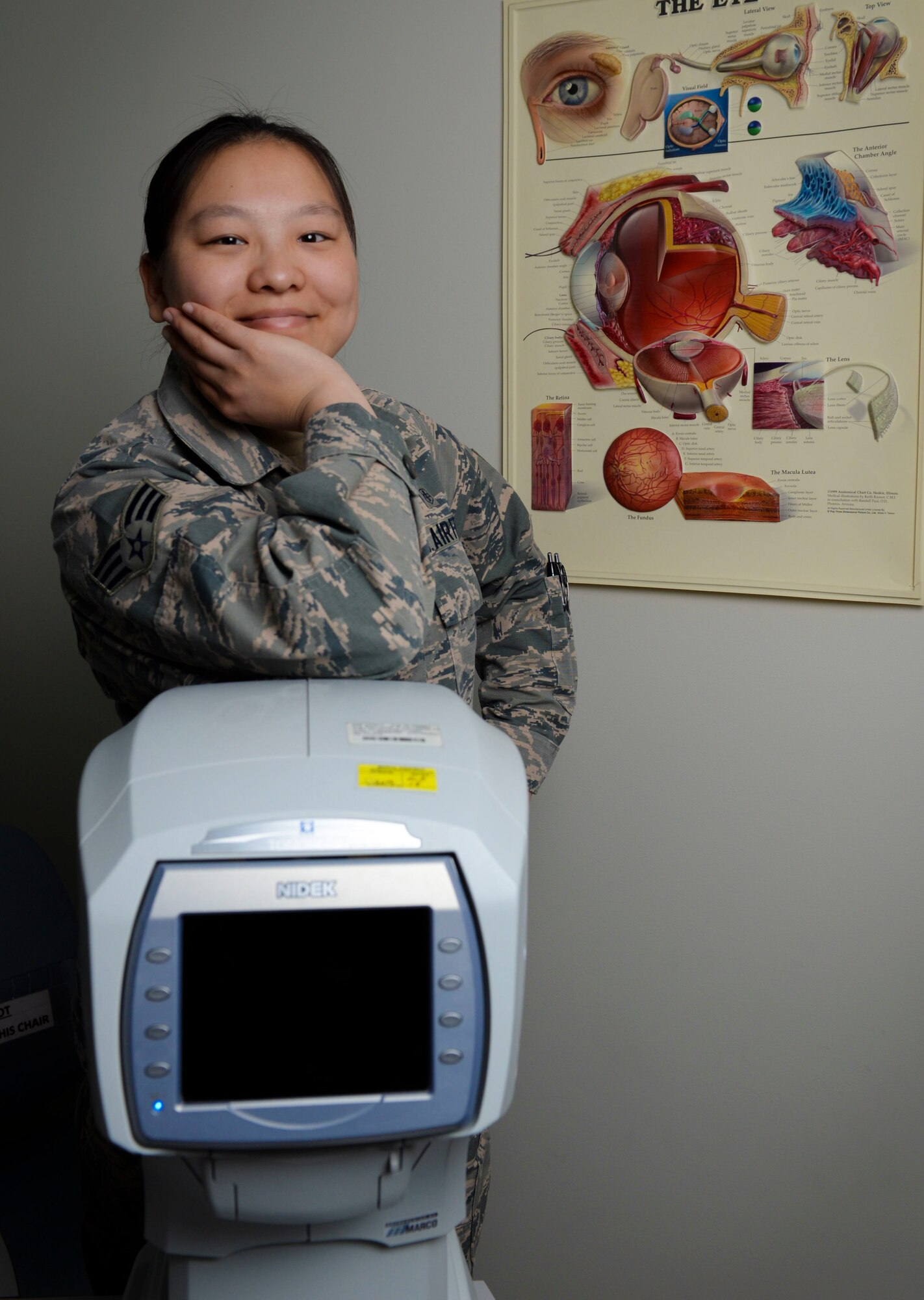Senior Airman Lin Evenson, 99th Aerospace Medical Squadron ophthalmic technician, poses for a photo in her office on Nellis Air Force Base, Nevada. Evenson went from being a poor orphan in China to a successful Airman in the U.S. Air Force. (U.S. Air Force photo by Airman 1st Class Andrew D. Sarver)