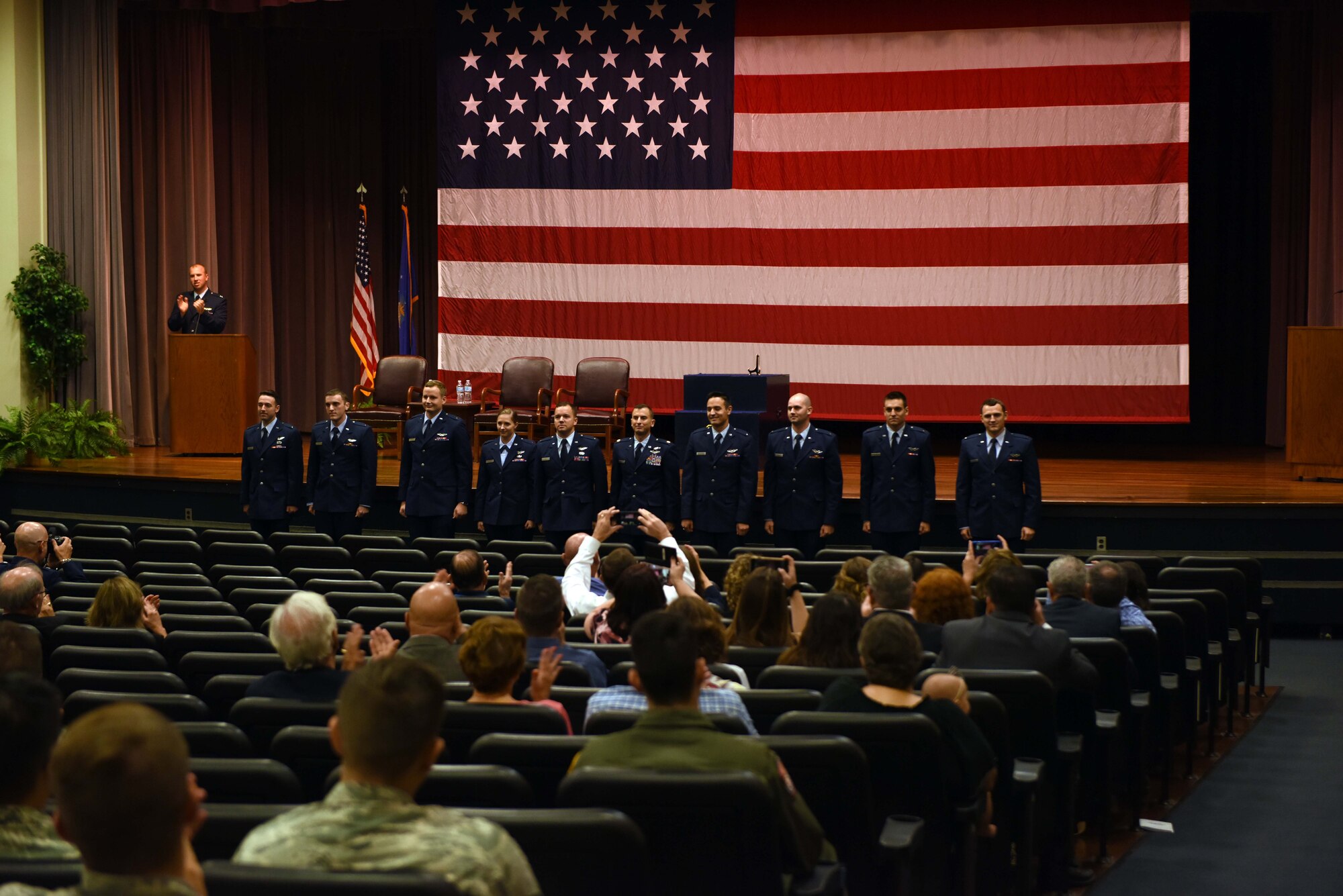 New graduates from Specialized Undergraduate Pilot Training Class 18-15 are recognized for completing their training Sept. 28, 2018 on Columbus Air Force Base, Mississippi. SUPT is comprised of three parts; academics, T-6A Texan II training, and either T-1A Jayhawk or T-38C Talon training. (U.S. Air Force photo by Airman 1st Class Beaux Hebert)