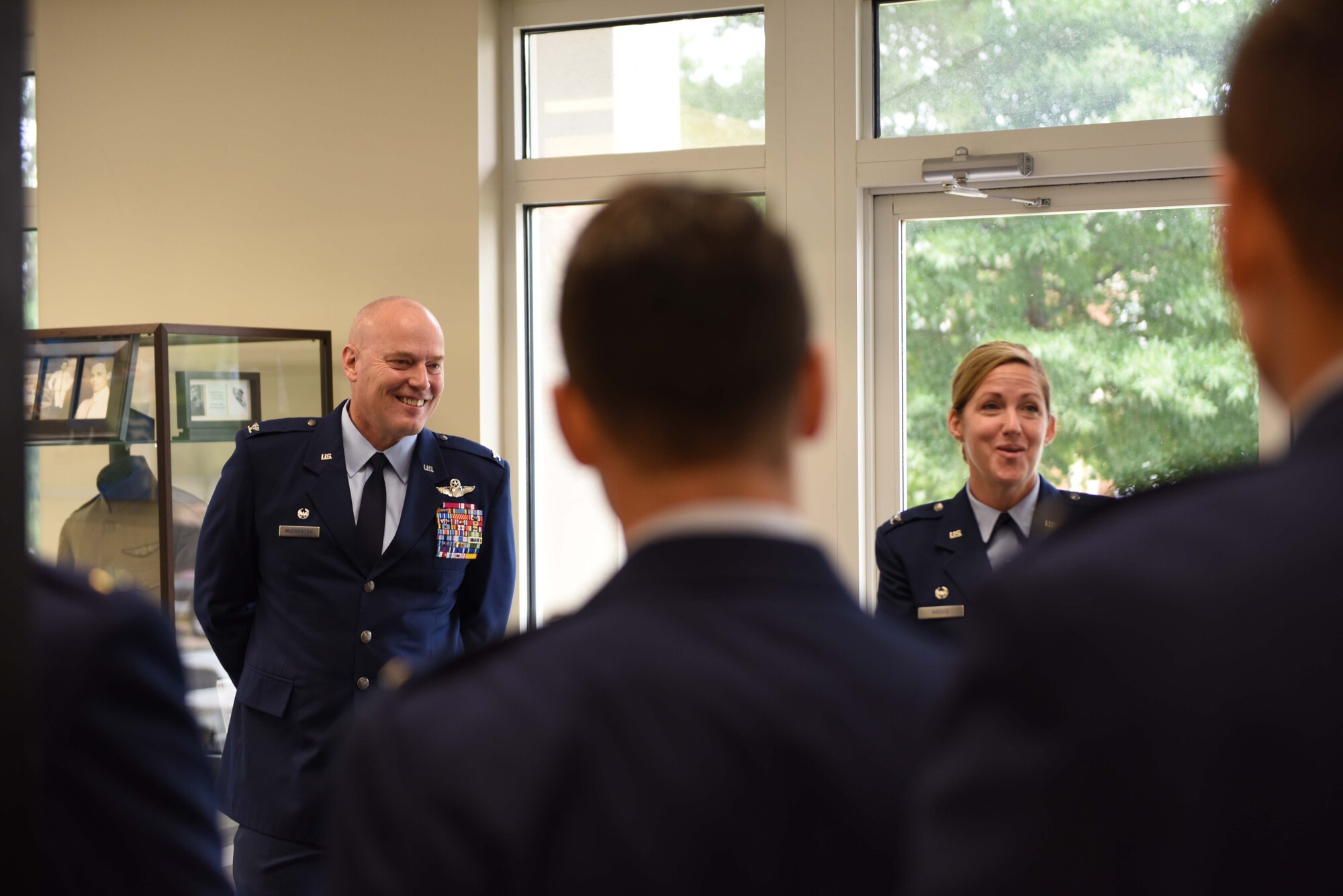 Col. Daniel McDonough, 182nd Airlift Wing commander, Peoria Air National Guard Base, Illinois, and Col. Samantha Weeks, 14th Flying Training Wing commander, speak with Specialized Undergraduate Pilot Training Class 18-15 students before their graduation Sept. 28, on Columbus Air Force Base, Mississippi. McDonough told the graduates how they are a part of the Air Force during a great time in its history. (U.S. Air Force photo by Airman 1st Class Beaux Hebert)