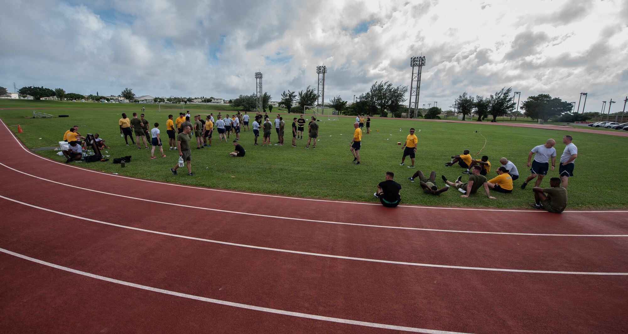 U.S. service members take a break during the Okinawa Joint Fitness Challenge Sept. 26, 2018, at Kadena Air Base, Japan. Service members from the Army, Navy, Air Force and Marine Corps were equally broken up into four classes to provide a joint learning environment. (U.S. Air Force photo by Staff Sgt. Micaiah Anthony)