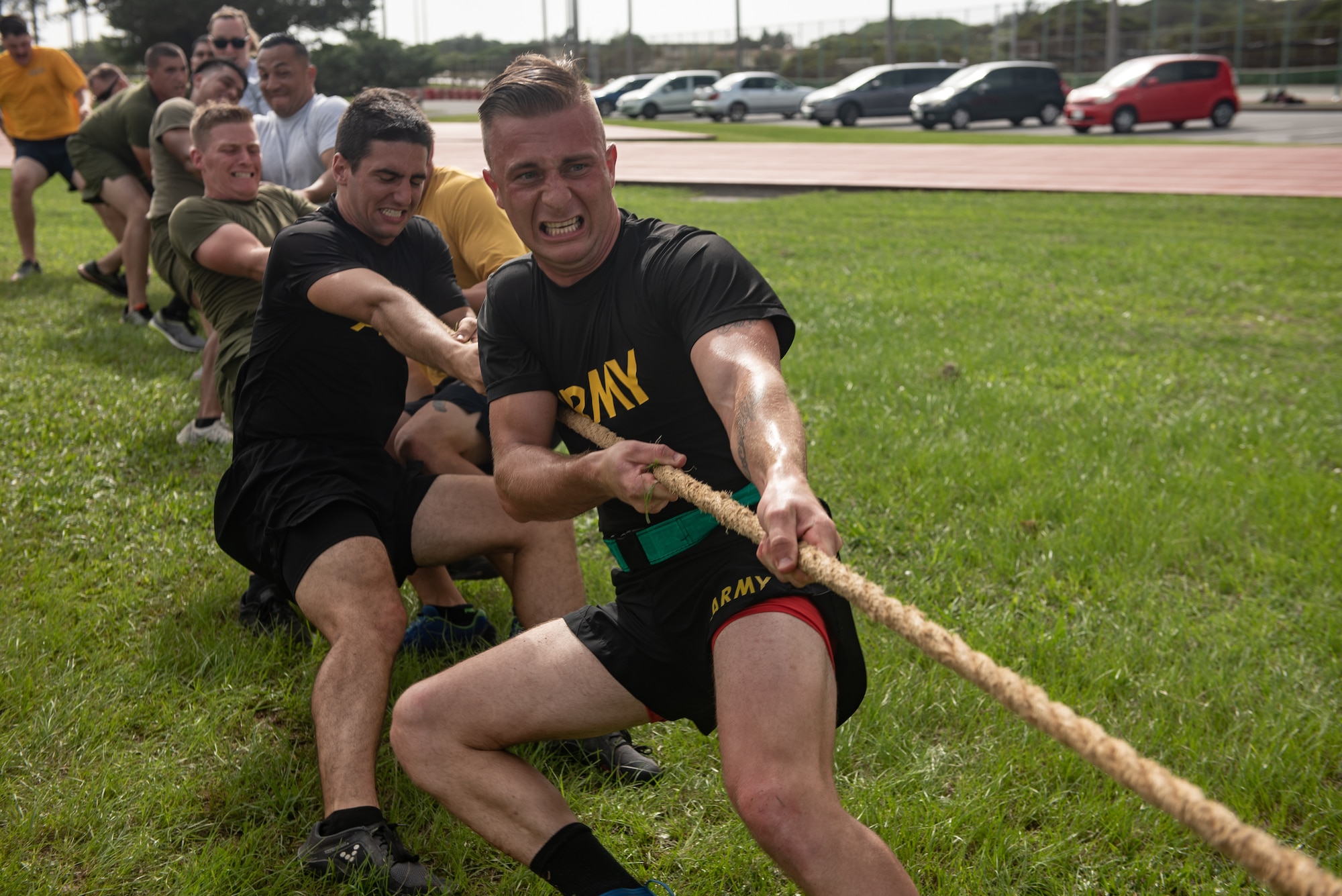 Members of the Blue Team compete in a game of tug-of-war during the Okinawa Joint Fitness Challenge Sept. 26, 2018, at Kadena Air Base, Japan. The OJFC was a portion of the OJE that enabled students to bond while overcoming obstacles and challenges faced in the battlefield. (U.S. Air Force photo by Staff Sgt. Micaiah Anthony)