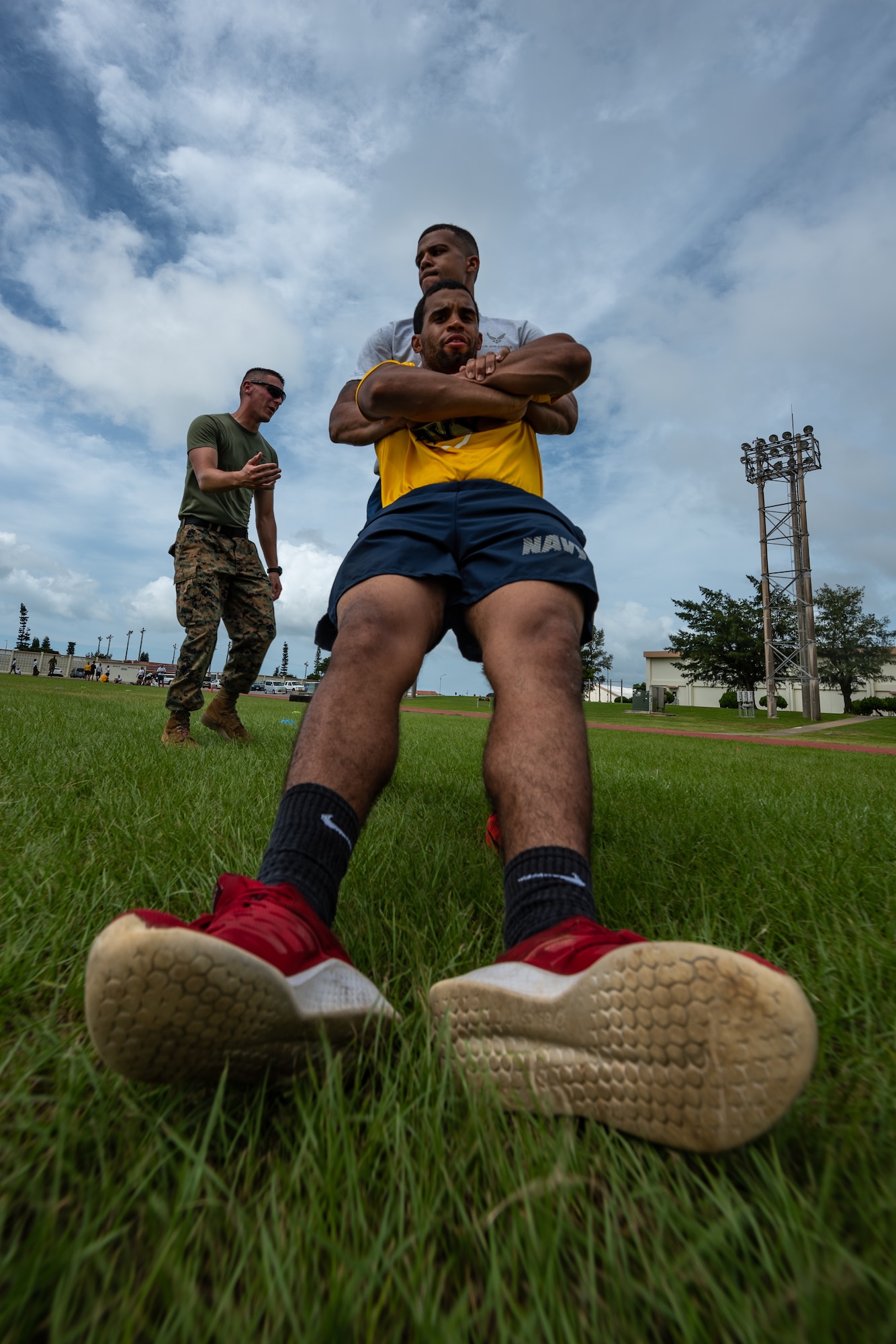 U.S. Air Force Staff Sgt. Thomas Nollie carries U.S. Navy Petty Officer 2nd Class Jesse Pedrero, both Okinawa Joint Experience Green Team students, during the Okinawa Joint Fitness Challenge Sept. 26, 2018, at Kadena Air Base, Japan. Service members from the Army, Navy, Air Force and Marine Corps were equally broken up into four classes to provide a joint learning environment. (U.S. Air Force photo by Staff Sgt. Micaiah Anthony)