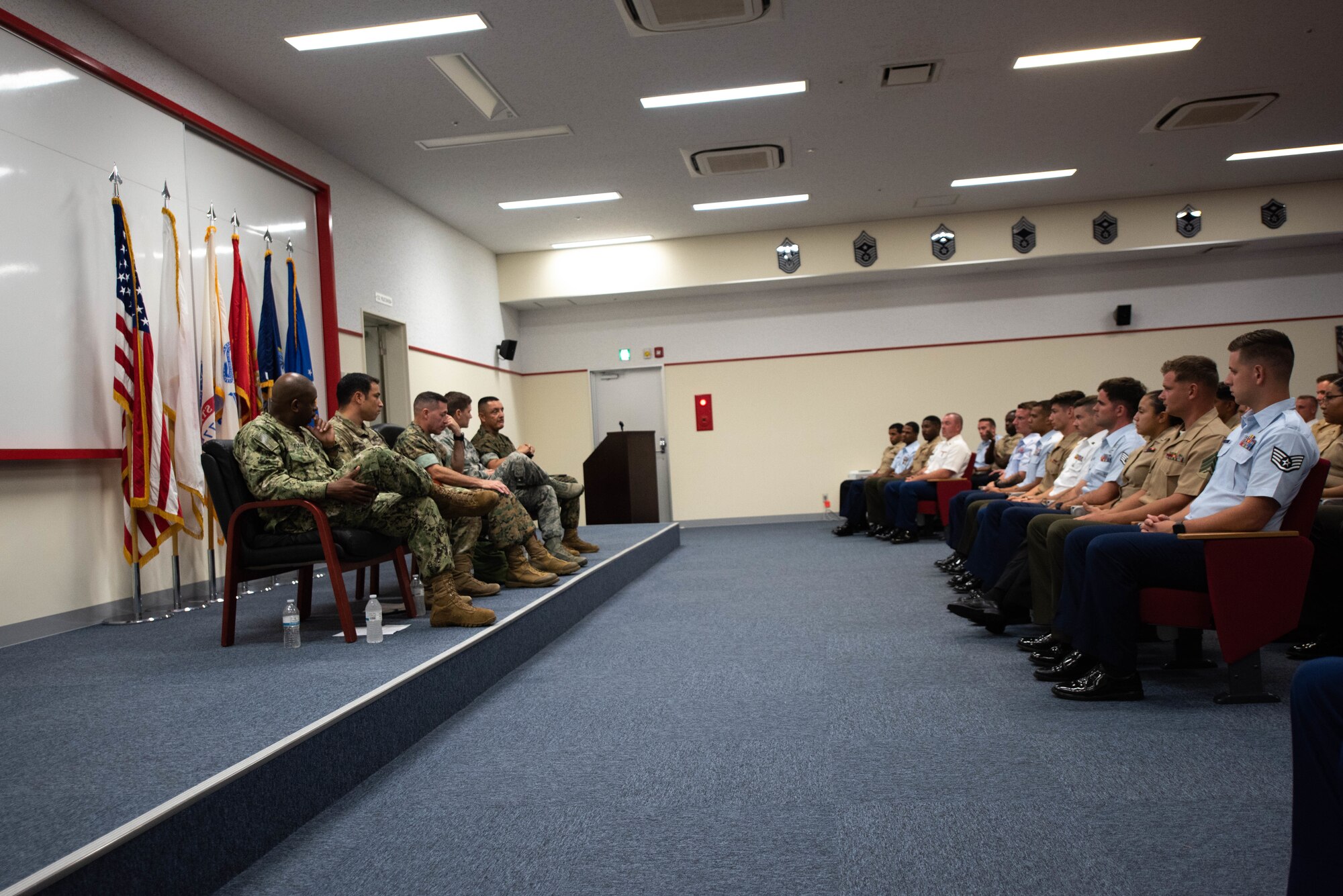 U.S. service members stationed in Okinawa participate in an Okinawa Joint Experience panel Sept. 27, 2018, at Kadena Air Base, Japan. Key leadership from each branch of service attended the panel and answered questions about the three-day course as part of the OJE. (U.S. Air Force photo by Senior Airman Kristan Campbell)