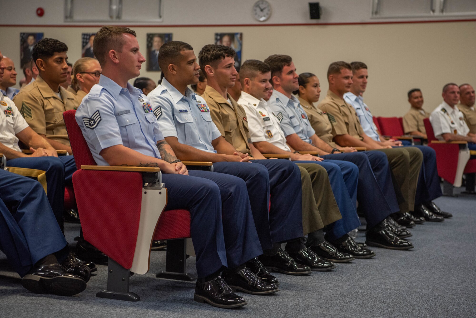 U.S. service members stationed in Okinawa participate in an Okinawa Joint Experience panel Sept. 27, 2018, at Kadena Air Base, Japan. Key leadership from each branch of service attended the panel and answered questions about the three-day course as part of the OJE. (U.S. Air Force photo by Senior Airman Kristan Campbell)